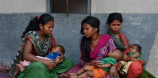 Women with new born babies in Asia